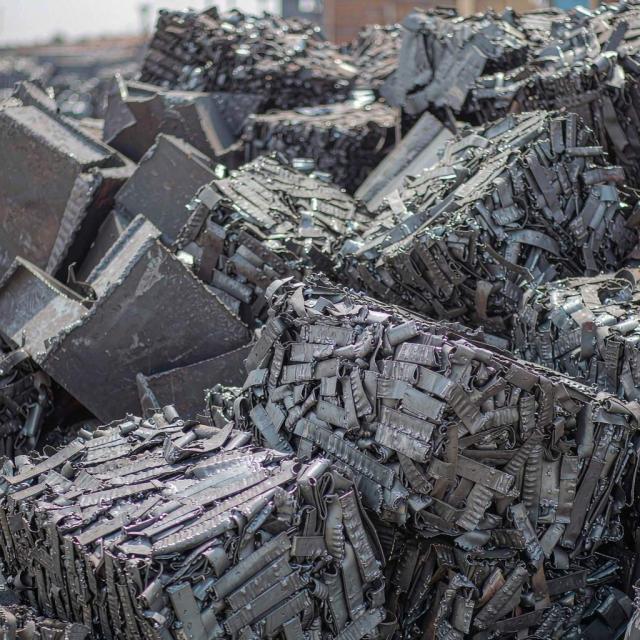 Shredded and sheared furnace-ready scrap steel feedstock prepared for steel mill delivery